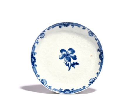 A rare Worcester blue and white saucer  c.1758-60, painted with the Anemone pattern, a single bloom within a wide floral moul