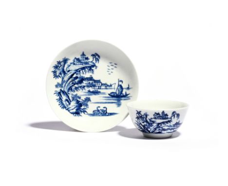 A rare Worcester blue and white teabowl and saucer c.1757-60, printed with the Two Swan Precipice pattern, two swans swimming