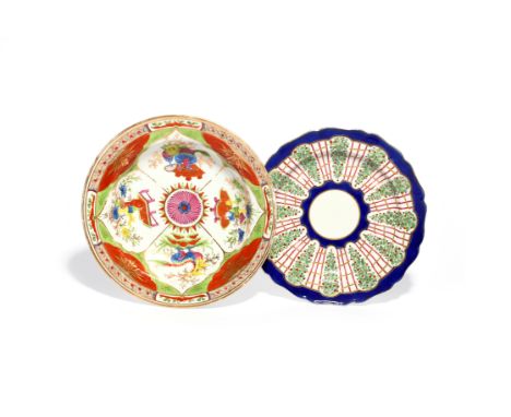 A Worcester plate c.1770, decorated with a Hop Trellis pattern of vertical berried swags alternating with puce and gilt trell