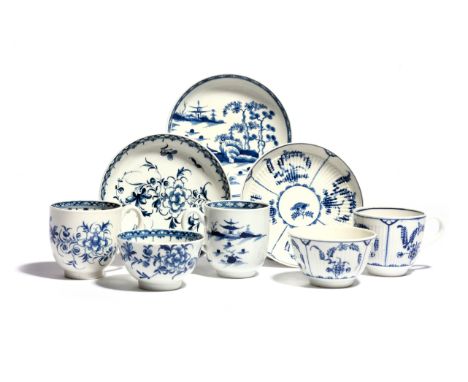 Two Worcester blue and white trios c.1760-70, each comprising a teabowl, coffee cup and saucer, one of finely reeded form and