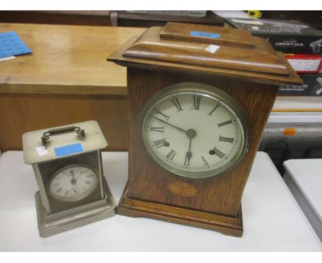 An Edwardian inlaid oak cased mantel clock with painted dial and Roman numerals and an early 20th century American nickel pla