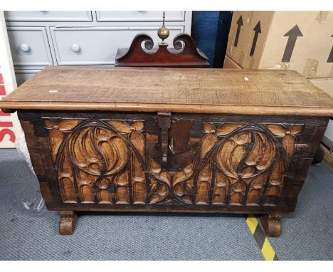 A Gothic style carved oak trunk, 56 h x 110 w x 40cm d 