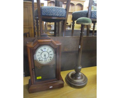A walnut cased 19th century mantel clock with white painted roman dial marked by makers insignia and patent 'July 1878' and a