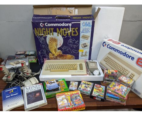 A Commodore C64 computer Night Moves boxed set to include the computer 1530 Datassette unit, two joysticks, manual and games,