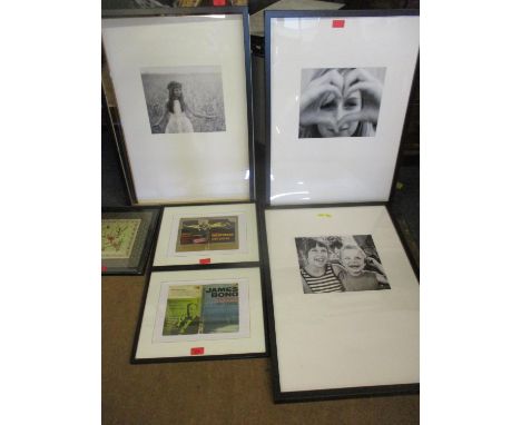 Two framed vintage Pan book covers of James Bond paperback books, a framed oriental silk panel and three contemporary black a