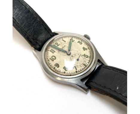 A Cortebert military wrist watch, with luminous Arabic numerals, the back inscribed with broad arrow above 'ATP 76675', appro