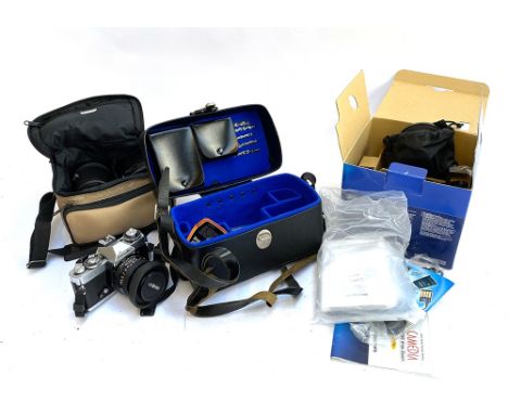 An Olympus C-5060 wide zoom camera, an Aldis colour slide projector, a Haynorama cine editor, and a Minolta XD7 camera with l
