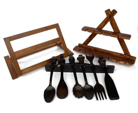 A folk art carved utensil shelf together with a rustic utensil shelf and wooden book stand 46cmW