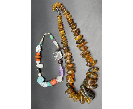 Antique/ Vintage Unique raw amber bead necklace. Beads vary in sizes. Fitted with a white metal clasp and catch [172.01grams]