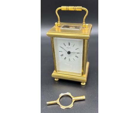 Heavy brass carriage clock produced by Angelus- made in England. Single barrel movement- 11 jewels. Comes with key. [12x8x6cm