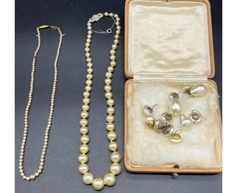 A Vintage pearl necklace designed with a 9ct gold clasp and catch, together with another pearl necklace designed with a silve