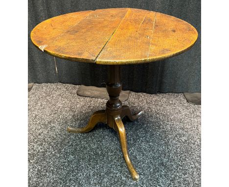 18th/19th century snap top table, the circular top raised on a tripod base [64cm high, 64cm in diameter] 