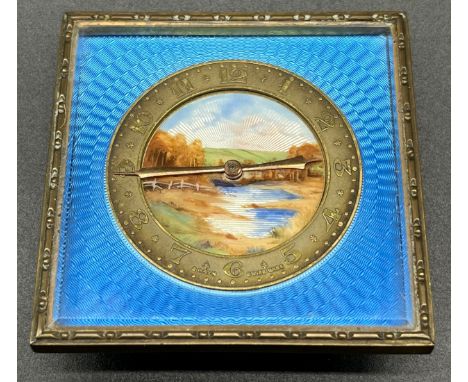 Art Deco brass and enamel 8 day Swiss Made travel clock, Blue enamel ground, brass dial and centre enamel design landscape. T