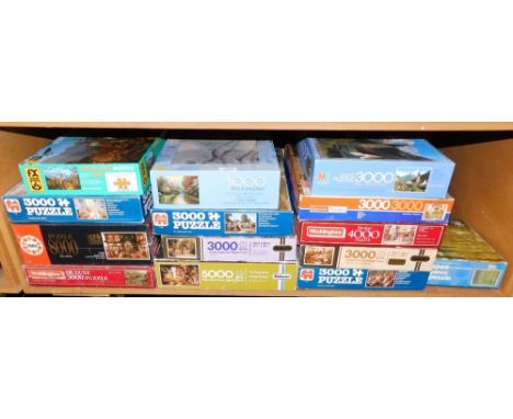 A quantity of jigsaw puzzles, mainly 3000 pieces plus. (1 shelf)