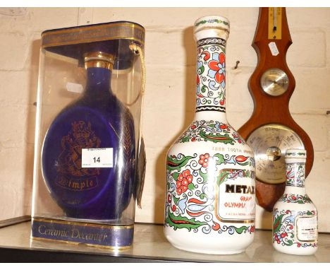Dimple ceramic decanter of whisky, a 100th Anniversary decanter of Metaxa and a smaller similar
