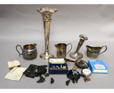 A George III silver cream jug, London, a weighted silver candlestick (a.f), a weighted silver vase by Walker &amp; Hall, Shef