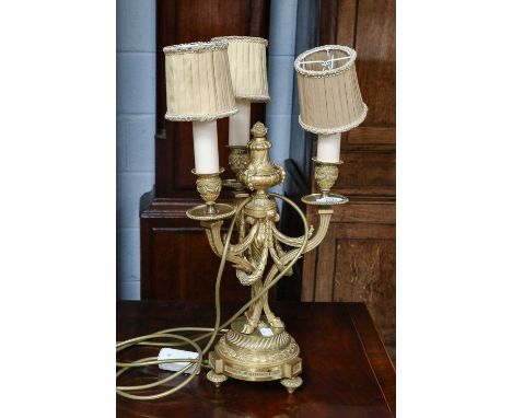 A French Neoclassical gilt bronze three branch table lamp, with presentation inscription, 33.5cm to the fitting 