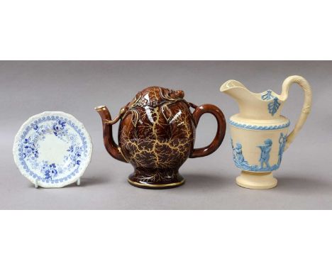 A caneware jug, Cadogan teapot and a small plate