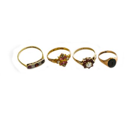 A 9 carat gold bloodstone signet ring, finger size F; a 9 carat gold split pearl and garnet cluster ring, finger size N1/2; a