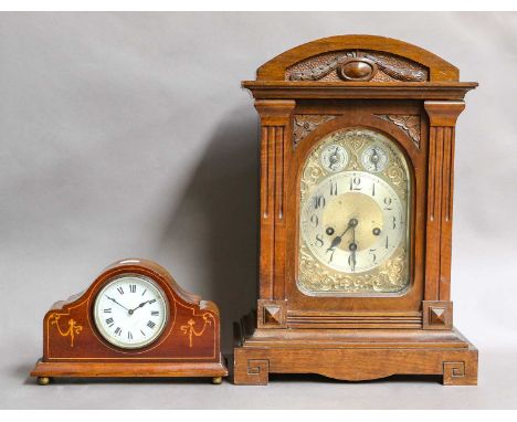 A German chiming table clock, circa 1900, movement chiming on four gong rods and striking a gong, backplate stamped Junghans,