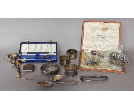 A tray of assorted silver items, including: a cased set of six demitasse spoons with coffee bean terminals, vesta case, vario