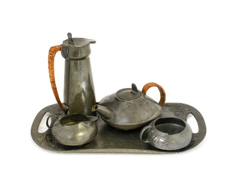 Archibald Knox (1864-1933): for Liberty &amp; Co.: A Tudric Pewter Three Piece Tea Service, cast in low relief with vines, co