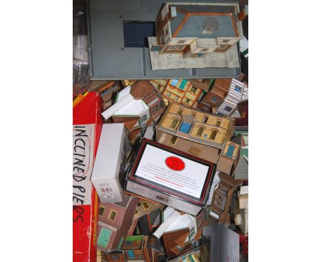 A LARGE collection of assorted vintage plastic and cardboard 00 gauge railway trainset trackside buildings and related items.