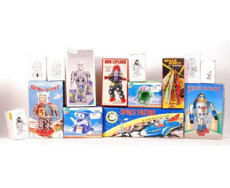 A collection of 14x assorted boxed robots and space related tinplate clockwork toys. All appear mint and unused, within the o