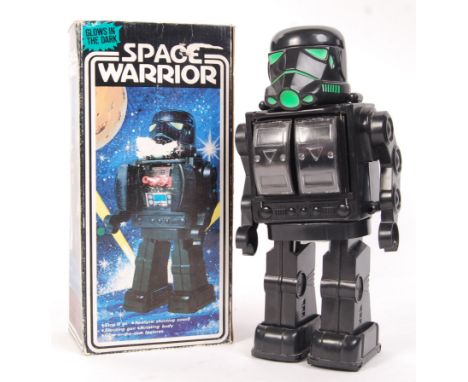 A vintage ' Space Warrior ' Battery Operated ' Made In Hong Kong ' classic style plastic robot. Within the original box. Clea