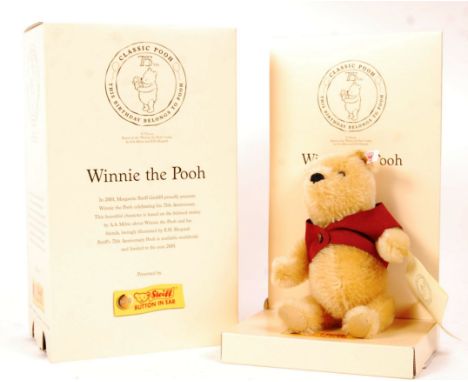 A 20th century Steiff teddy bear - ' Winnie The Pooh '. Golden mohair, with pronounced snout and red waistcoat. Complete with