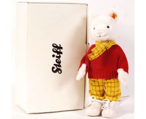 A rare limited edition Steiff made ' Rupert The Bear ' teddy bear. Complete with outfit. Steiff tag to ear, with information 