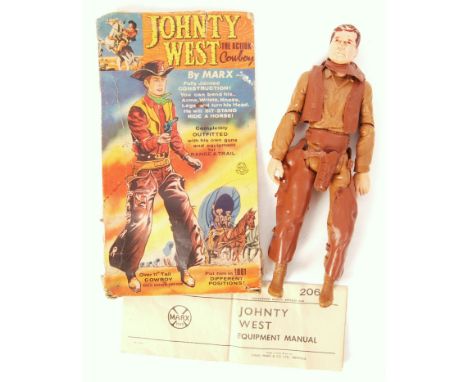 An original vintage Marx Toys made ' Johnty West ' Cowboy action figure. With his original instruction pamphlet and partial o