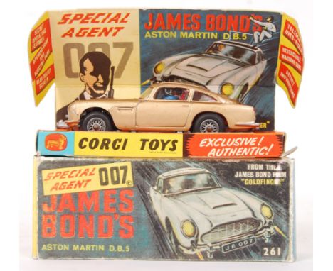 An original vintage Corgi Toys diecast model No. 261 ' James Bond 007 Aston Martin DB5 .' In gold, with silver spoked wheels.