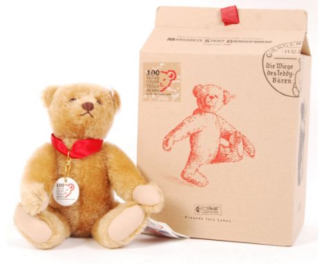 A 20th century Steiff teddy bear - ' 100 Years '. Brown mohair, with pronounced snout and humped back. Complete with certific