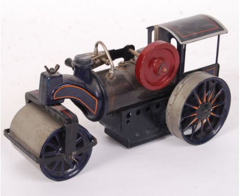 A rare German made Bing Werke live steam traction engine / steam roller. Single flywheel and piston to top. Blue, with orange