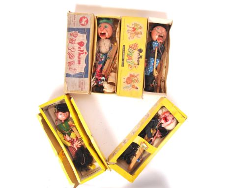 A collection of 4x vintage Pelham Puppet made puppets - all within boxes. Comprising of: SM Schoolmaster, SS Dutch Boy, Witch