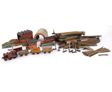 A rare antique early 20th century / 1920's Bing made German tinplate clockwork 00 gauge scale railway train set. Comprising o