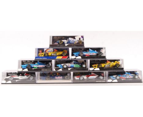 A collection of 9x Minichamps made 1:43 scale precision diecast model Formula One racing cars. All appear mint, unused, withi