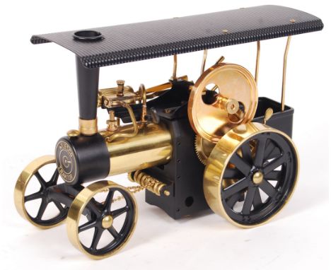 A beautiful vintage Wilesco made live steam ' Traktor ' Traction Engine. Black, with brass detailing. Appears complete, with 