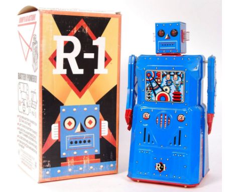 A fantastic ' Rocket USA ' made&nbsp; ' R-1 ' battery operated tinplate classic style robot. Appears mint, within the origina