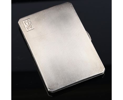 A George VI silver cigarette case, allover engine turned decoration with gilt interior, by E J Trevitt & Sons Ltd, hallmarks 