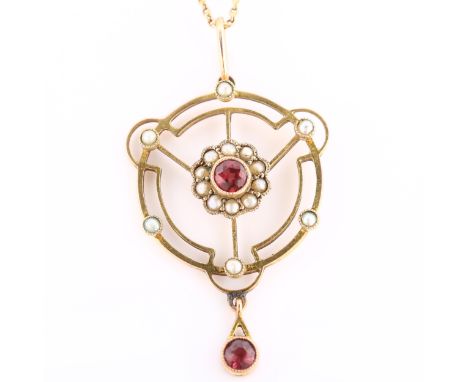 An Edwardian garnet and pearl openwork pendant necklace, unmarked gold settings, on 9ct fine fancy link chain, pendant height