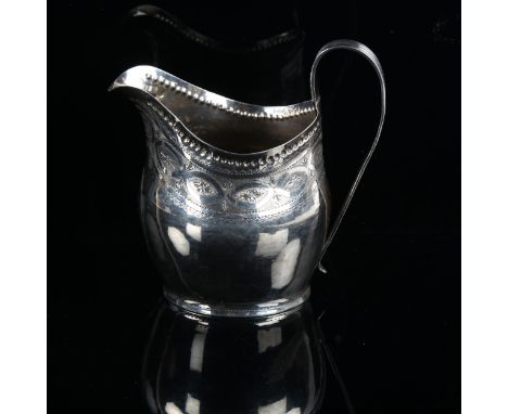 A George III silver helmet-shape cream jug, with bright-cut engraved decoration, indistinct maker's marks, hallmarks London 1
