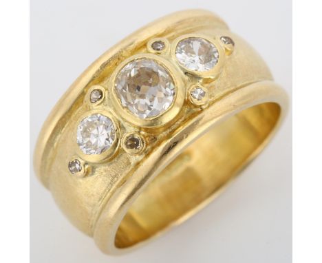 An 18ct gold diamond band ring, in the style of Elizabeth Gage, set with old, modern round brilliant and single-cut diamonds,