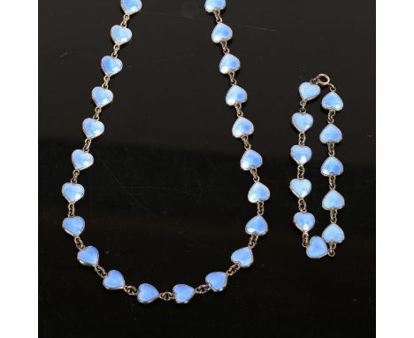 VOLMER BAHNER - a Danish stylised sterling silver and blue enamel heart matching necklace and bracelet set, length 42cm and 1