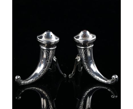 A pair of Norwegian silver cornucopia pepperettes, with Viking helmet decoration, Swedish import marks, height 6cmNo damage, 