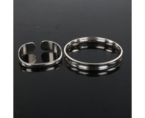 HANS HANSEN - a Danish stylised sterling silver slave bangle and similar torque napkin ring, bangle internal diameter 6.5cm, 