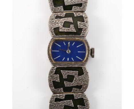 A lady's mid-century silver and enamel bracelet watch, blue enamel dial with white baton hour markers and heavy textured silv