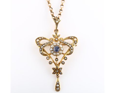 An Edwardian Art Nouveau 9ct gold sapphire and pearl floral pendant necklace/brooch, on 9ct rose gold belcher link chain, pen