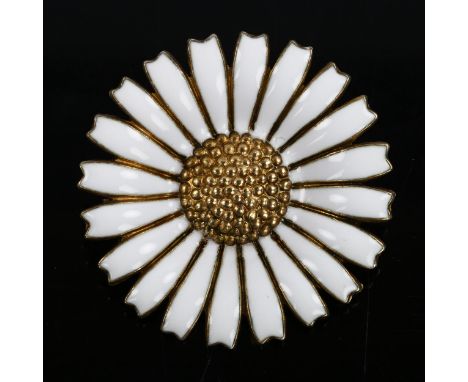 GEORG JENSEN - a Danish vermeil sterling silver and white enamel daisy pattern brooch, diameter 32.5mm, 9.9gNo damage or repa